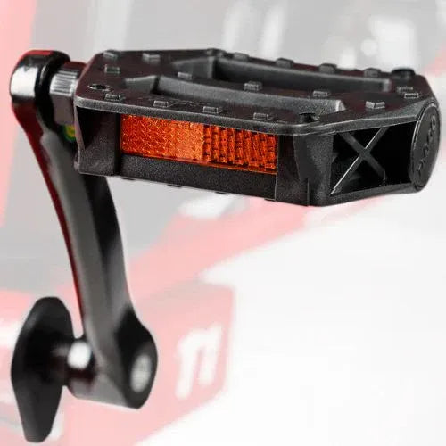 Close-up of a Turbo Trikes electric trike pedal with orange reflector and black crank arm