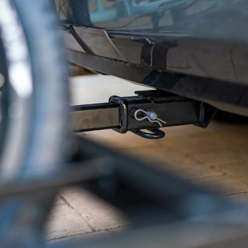 Close-up of hitch rack securely attached to vehicle for electric trike transport