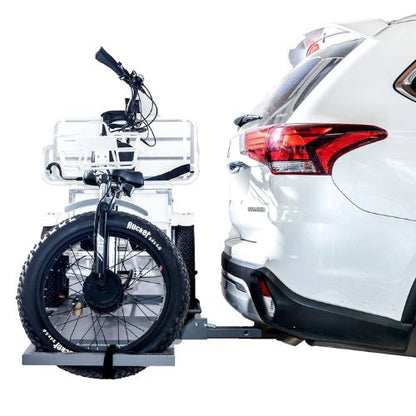 Electric trike with fat tires mounted on a car hitch rack for easy transport