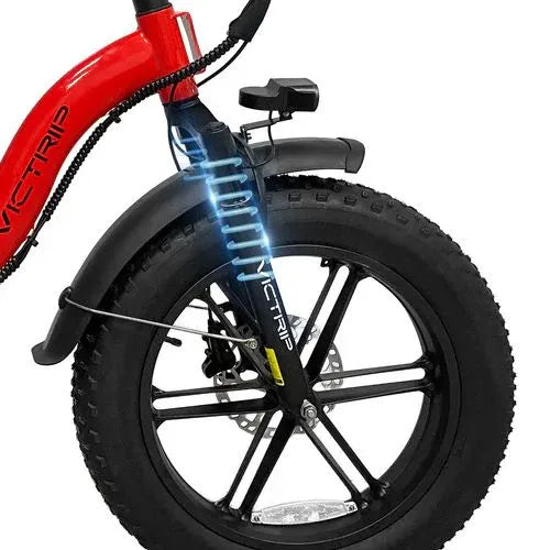 Front wheel of a red electric trike with fat tire and suspension, Turbo Trikes store