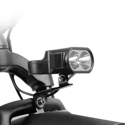Close-up of front LED headlight on Turbo Trikes electric trike for safe night riding
