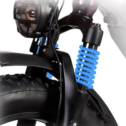 Front fork suspension and fat tire of an electric trike, close-up view